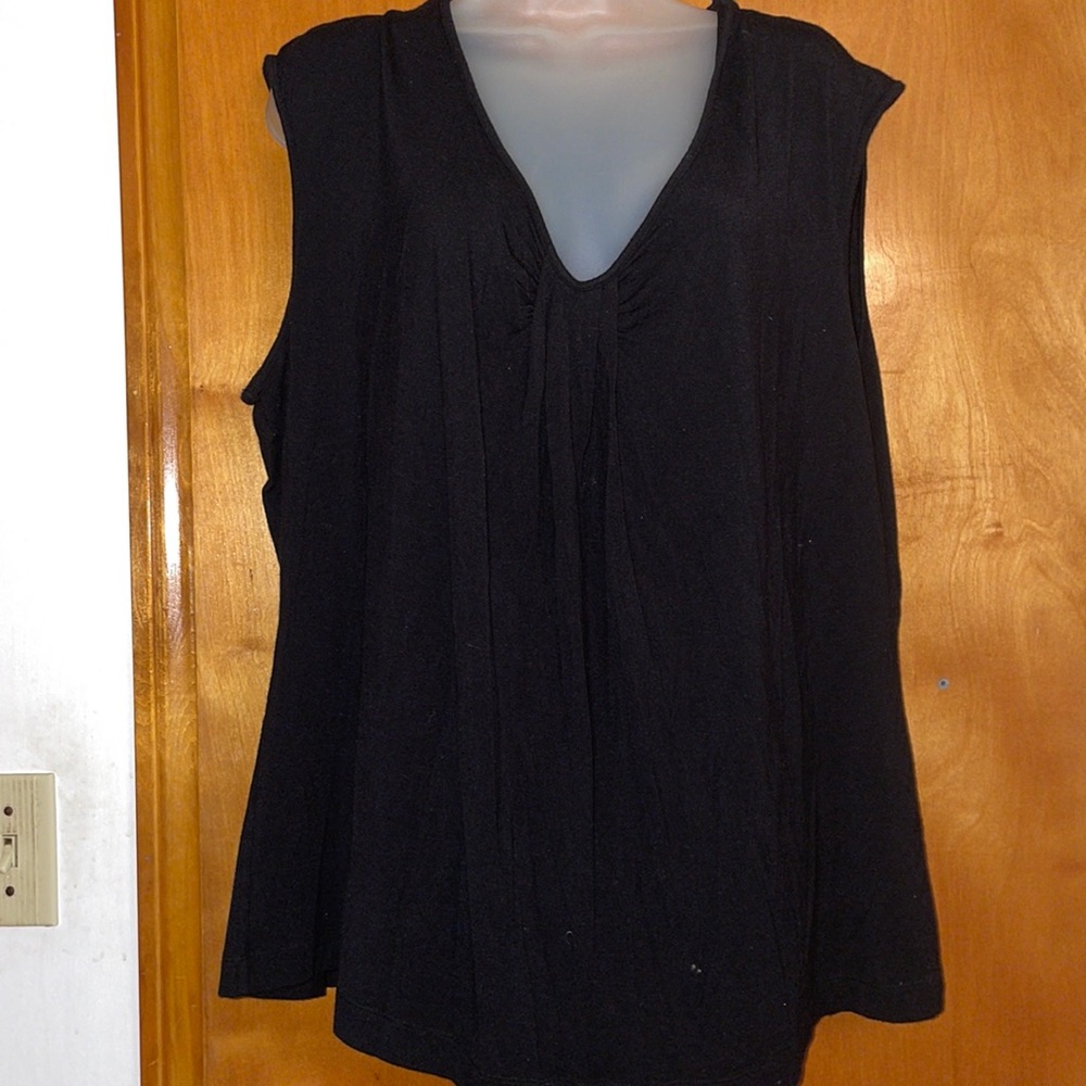 Black sleeveless V neck top with pleat in middle
